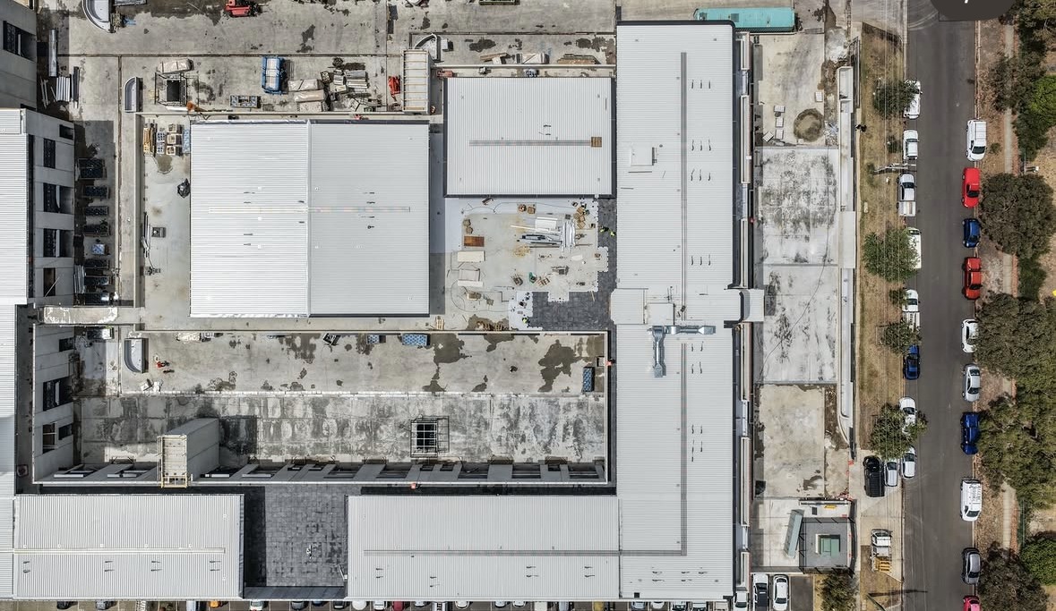 Aerial view of a large-scale commercial podium under construction